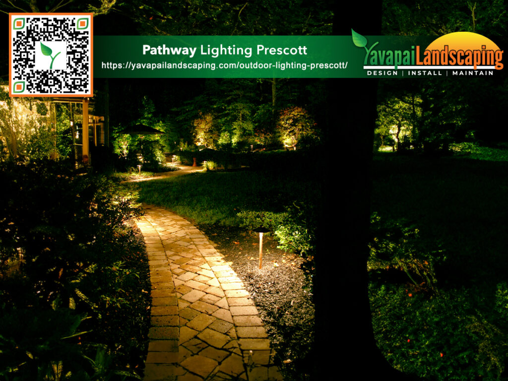 An illuminated evening garden path enhanced by elegant landscape lighting, inviting a serene night-time walk in nature, presented by yavapai landscaping prescott.