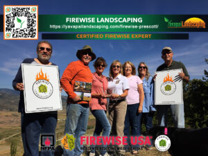 A group of six smiling adults holding Firewise USA certificates and standing outdoors with a backdrop of greenery in Prescott, AZ, promoting firewise landscaping. Two QR codes and logos are visible.