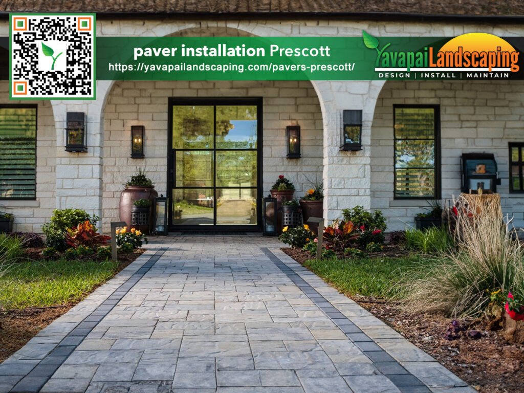 Elegant home entrance in Prescott, AZ with a newly installed paver walkway, flanked by vibrant floral landscaping and inviting decorative pots, proudly serviced by Yavapai Landscaping.