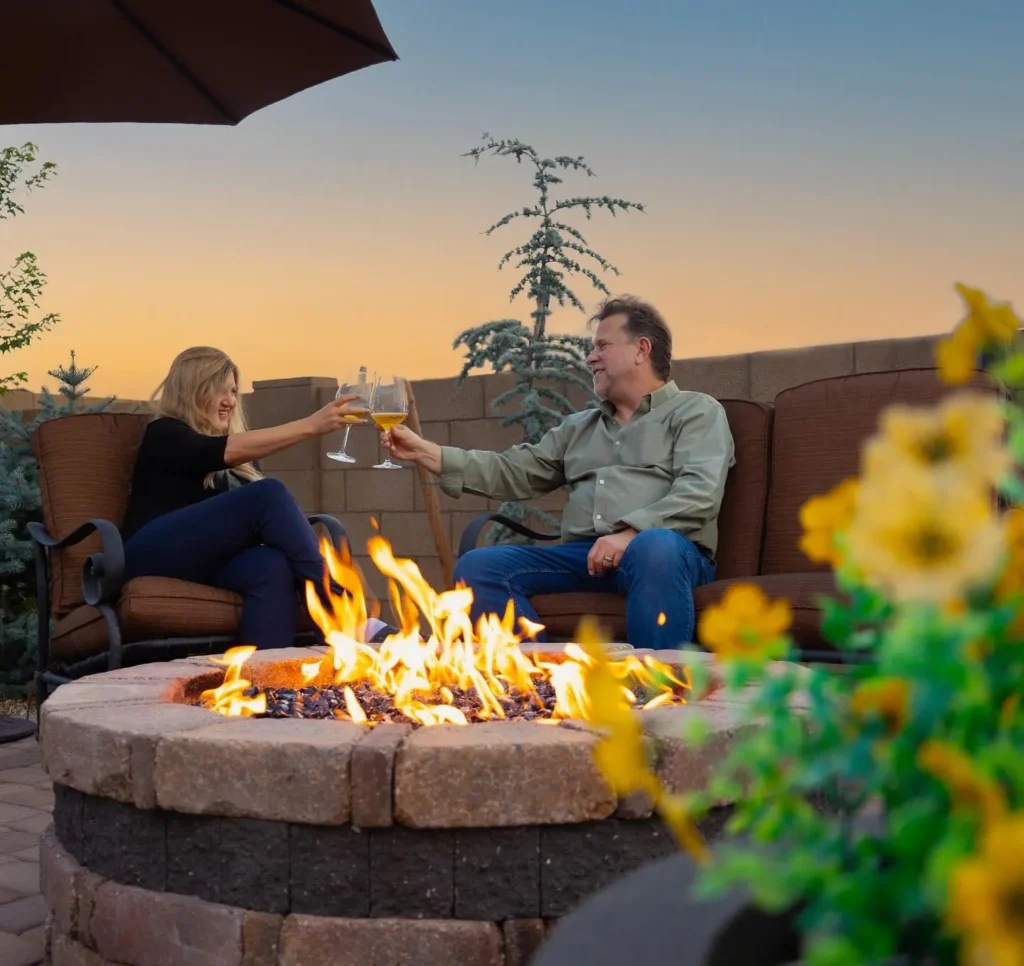 Fire-safe landscaping with fire-resistant plants and defensible spaces