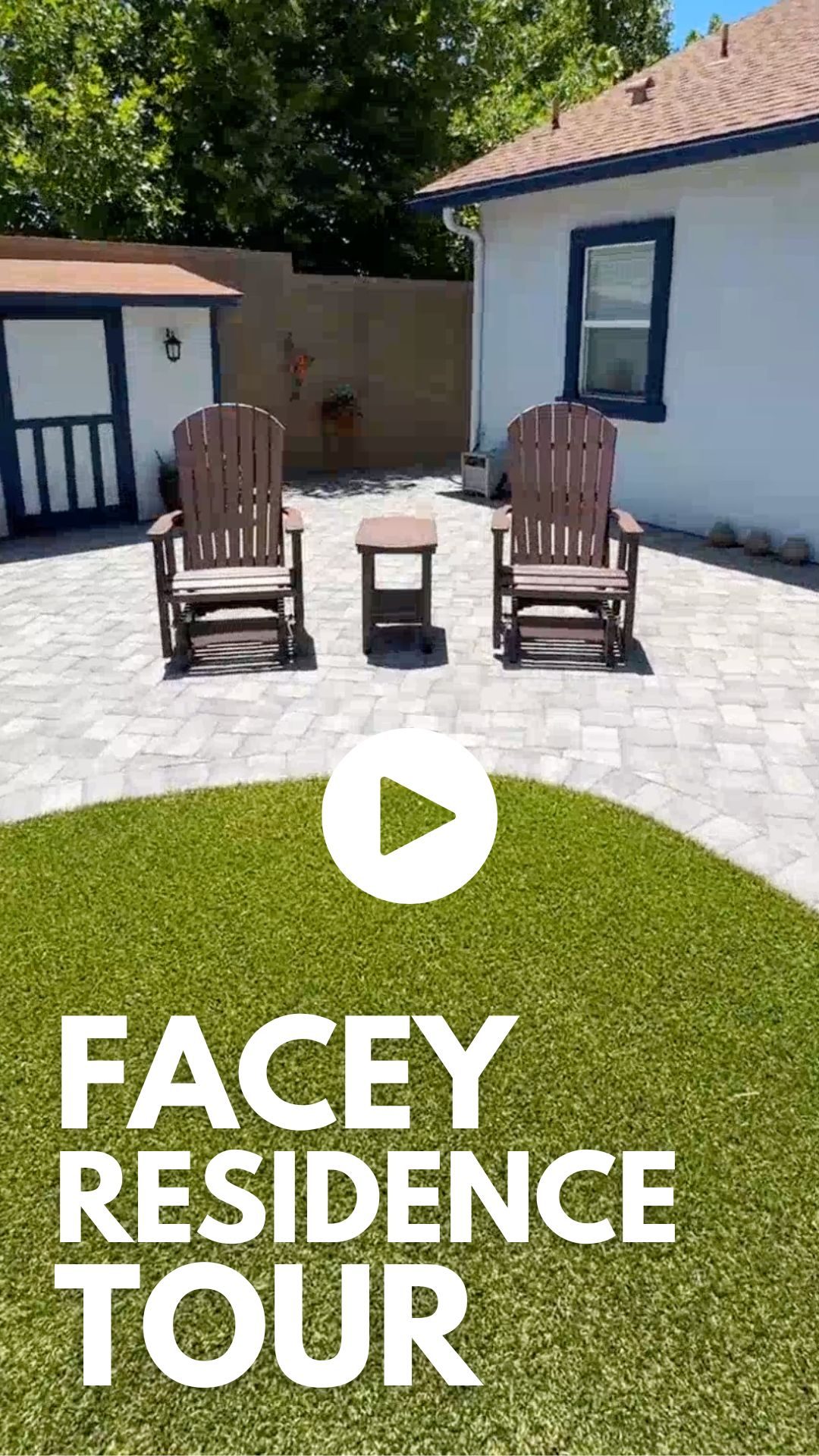 A sunny backyard with two wooden chairs and a small table on a beautifully laid paver patio. A white building with blue trim is in the background. The text reads "Facey Residence Tour" with a play button icon above it.